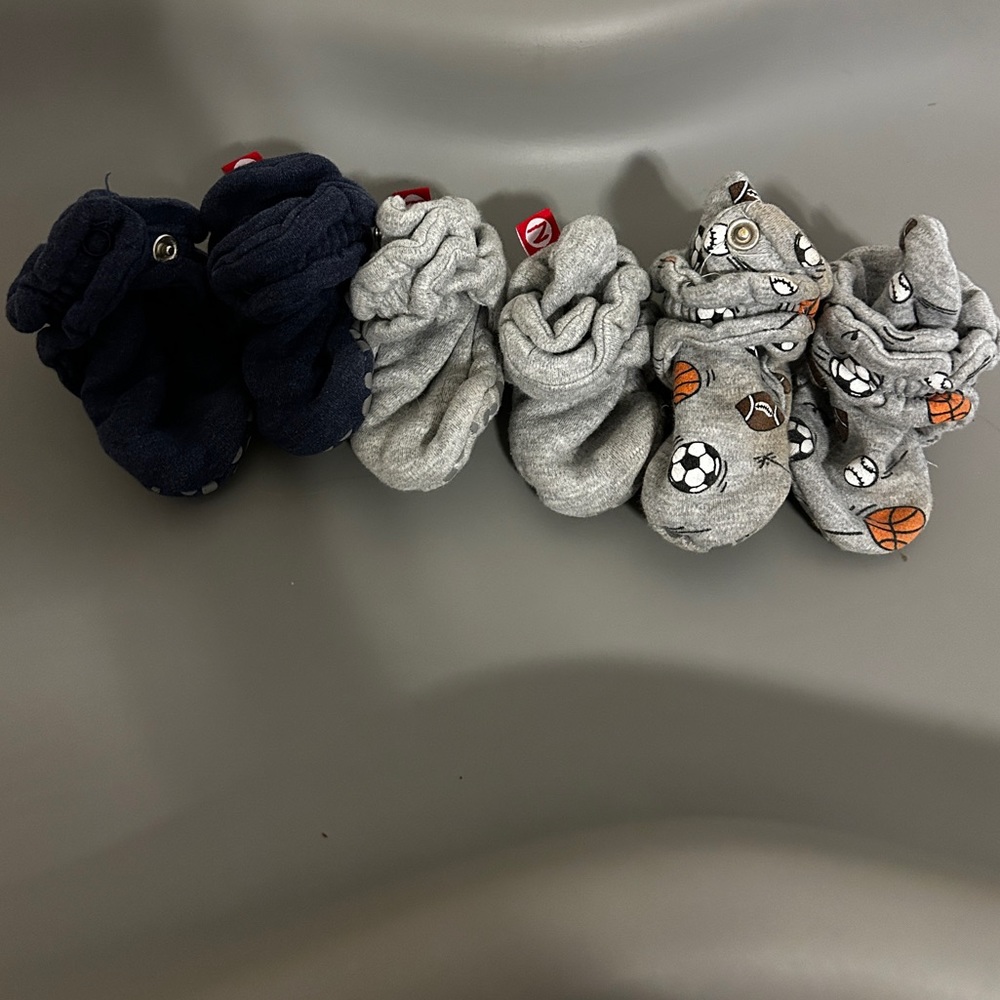 Three pairs of zutano booties